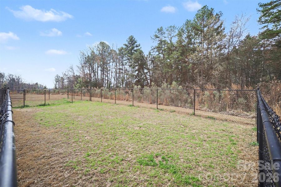 Community fenced open green area that is pet friendly