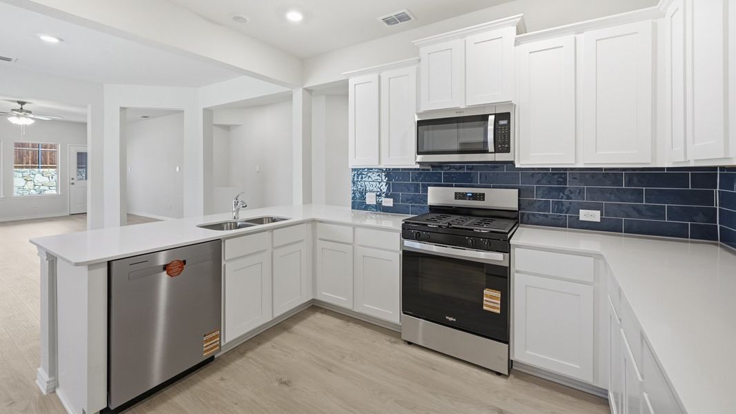 Representative furnished interior of a home built from the Tanzanite by D.R. Horton in Silverado, Aubrey (Image 6).