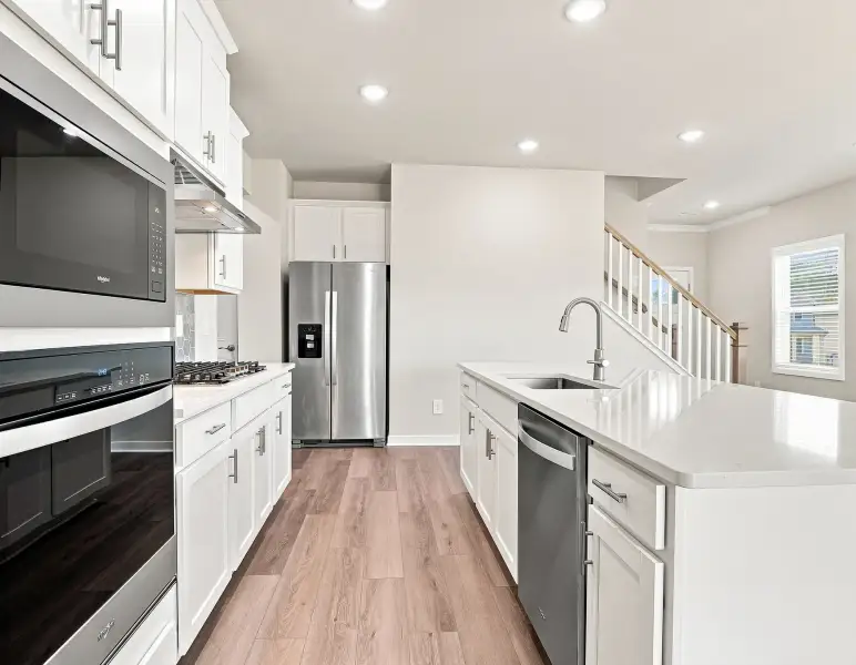 Furnished interior view inside a new home in Country Lane - Classic Series, Clayton (Image 4).
