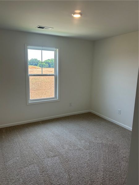 Sun-filled room with plush carpeting offers tranqu