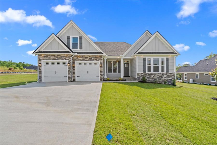 Representative exterior photo of a completed home built from the Hartford Elite by Enchanted Homes in Smokey Hills, Campobello, SC (Image 22).