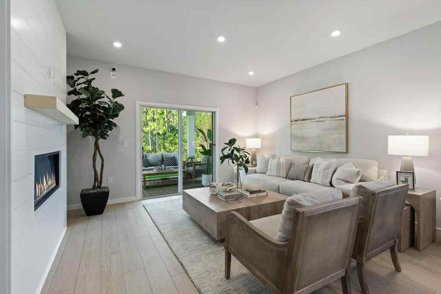 A living room with a couch and chairs.