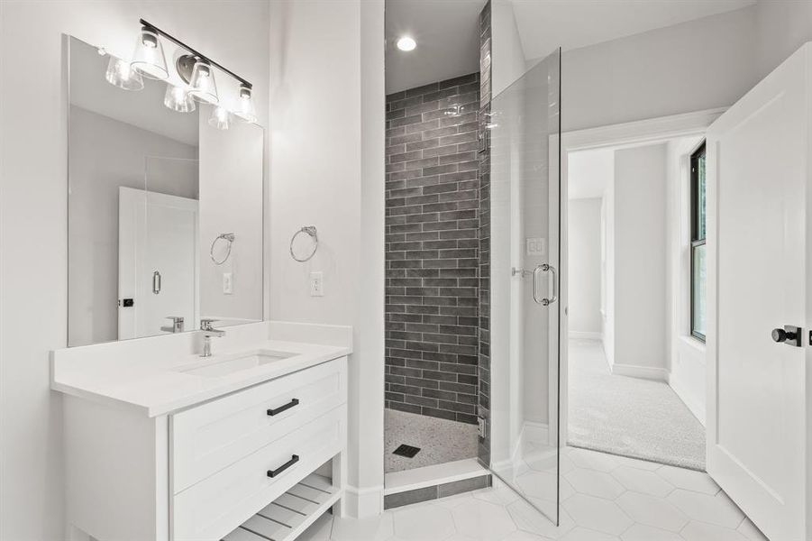 Full bath featuring light tile patterned floors, vanity, a shower stall, and recessed lighting Full bath featuring light tile patterned floors, vanity, a shower stall, and recessed lighting