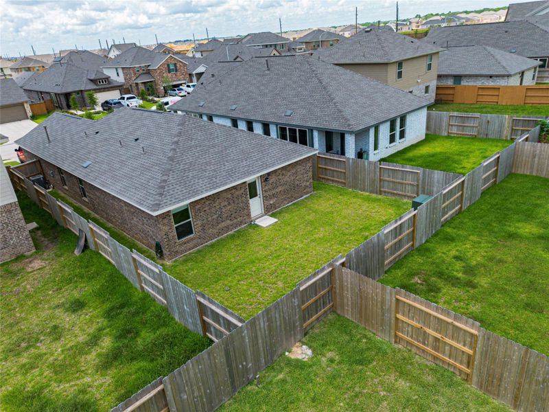 Exterior details and patio area of a home in Sunterra, Katy (Image 4).