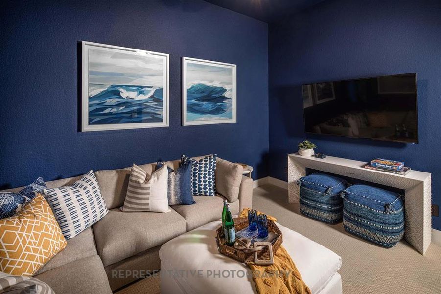 Carpeted living area with baseboards Carpeted living area with baseboards