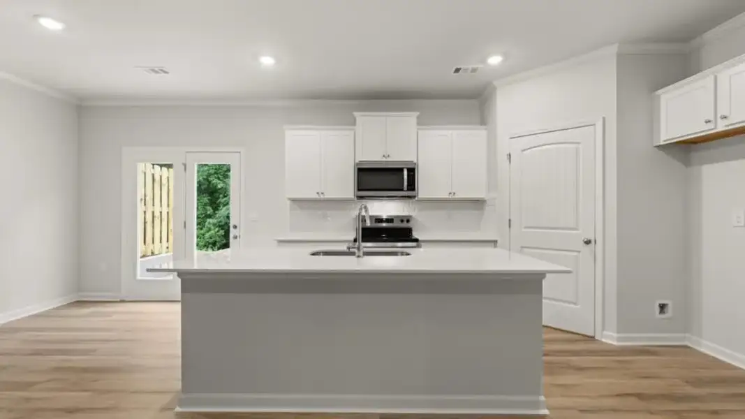Furnished interior view inside a new home in Waypoint, Flowery Branch (Image 9).