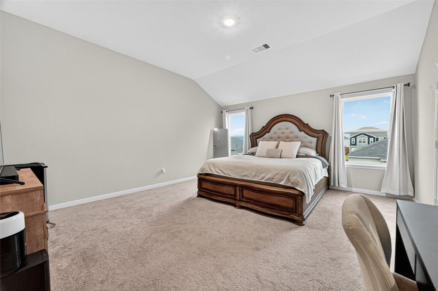 Primary bedroom with heightened ceilings. Primary bedroom with heightened ceilings.