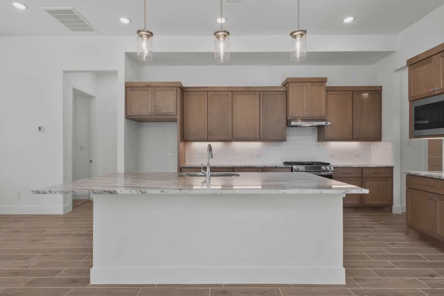 Representative furnished interior of a home built from the Sorenstam by Chesmar Homes in Riceland Alley Loads, Mont Belvieu (Image 6).