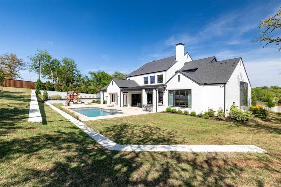 Large .87 lot with plenty of grass space and a sparkling pool!