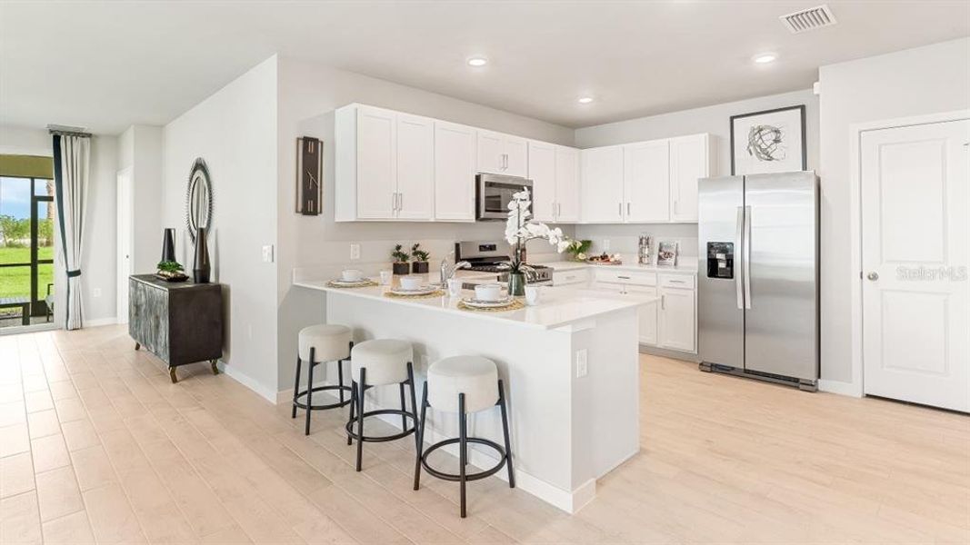 Furnished interior view inside a new home in Halifax Plantation Villas, Ormond Beach (Image 13).