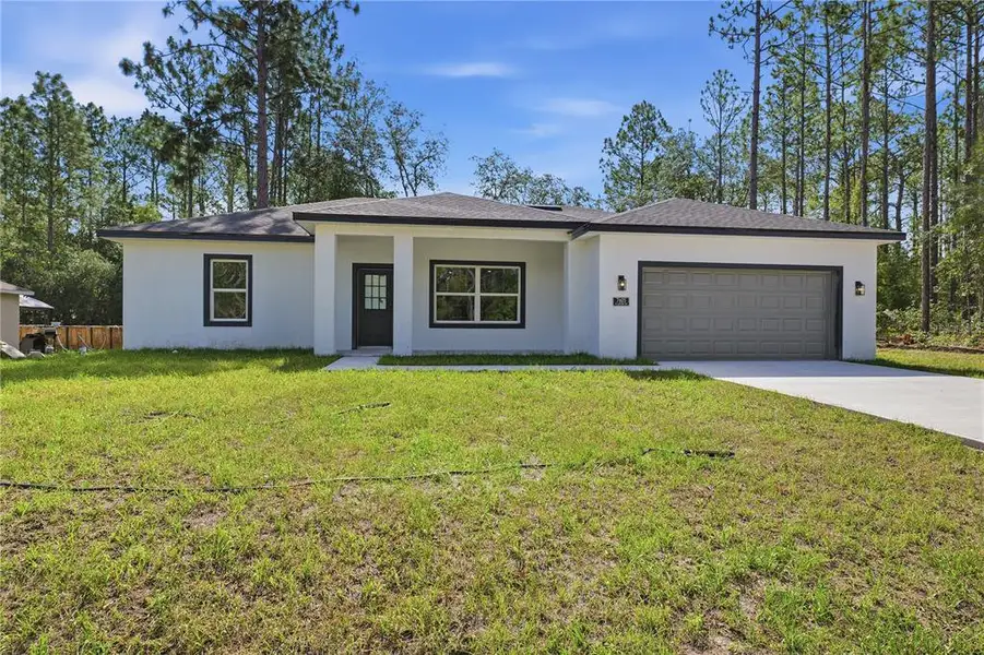 Front exterior of a new home in , Citrus Springs, FL, highlighting curb appeal (Image 2). Front exterior of a new home in , Citrus Springs, FL, highlighting curb appeal (Image 2).