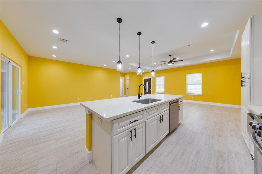 Kitchen island with built-in sink, offering additional workspace and a convenient focal point for meal prep and gatherings.