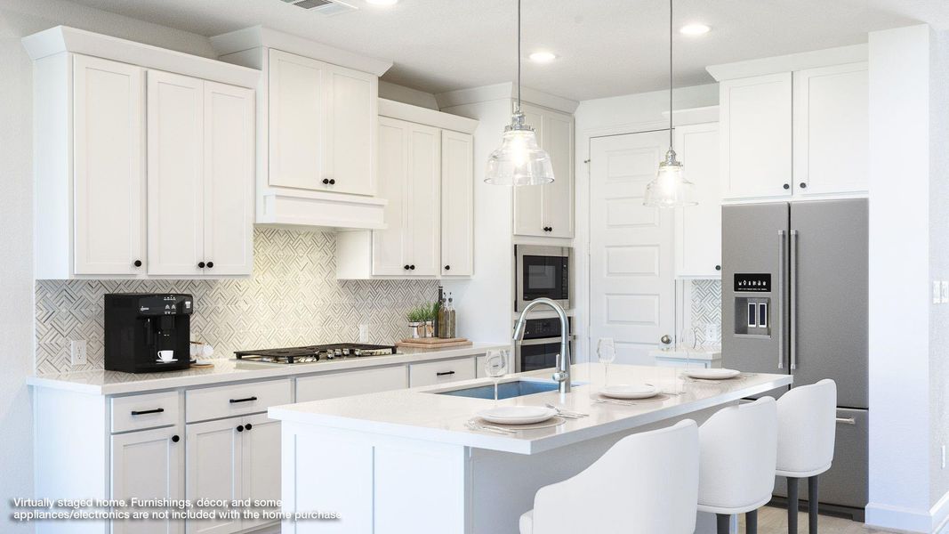 Kitchen featuring tasteful backsplash, appliances with stainless steel finishes, a breakfast bar, light stone countertops, and a kitchen island with sink Kitchen featuring tasteful backsplash, appliances with stainless steel finishes, a breakfast bar, light stone countertops, and a kitchen island with sink