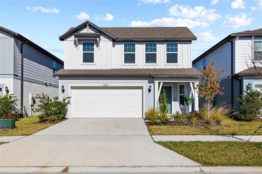 Front exterior of a new home in Waterset, Apollo Beach, FL, highlighting curb appeal (Image 24).