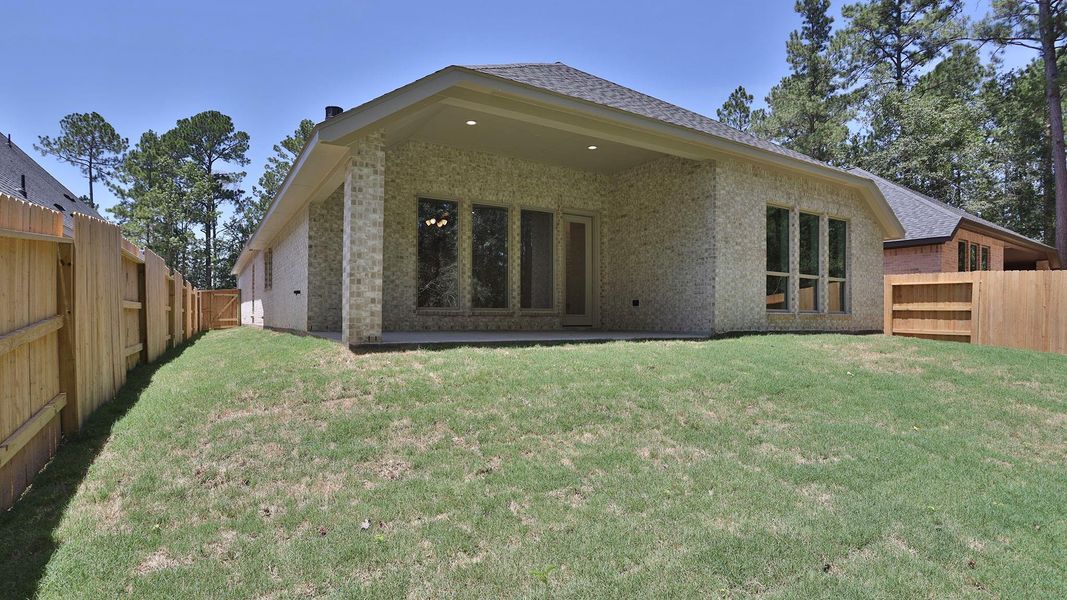 Exterior details and patio area of a home in Woodhavyn, Magnolia (Image 3).