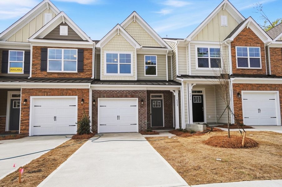 Front exterior of a new home in Harrisburg Village Townhomes, Harrisburg, NC, highlighting curb appeal (Image 26).