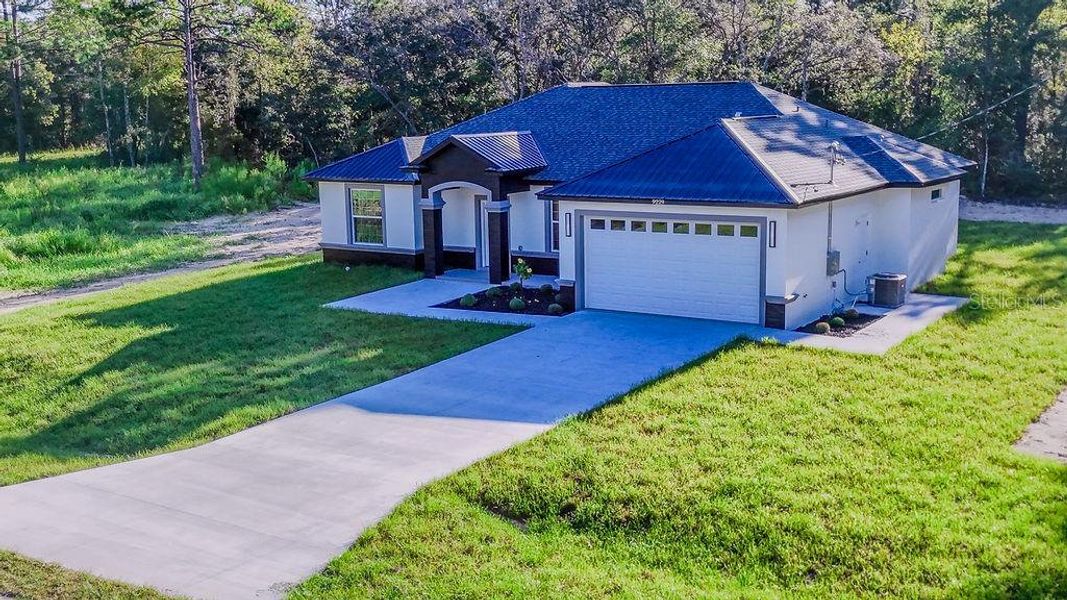 Front exterior of a new home in , Dunnellon, FL, highlighting curb appeal (Image 29). Front exterior of a new home in , Dunnellon, FL, highlighting curb appeal (Image 29).