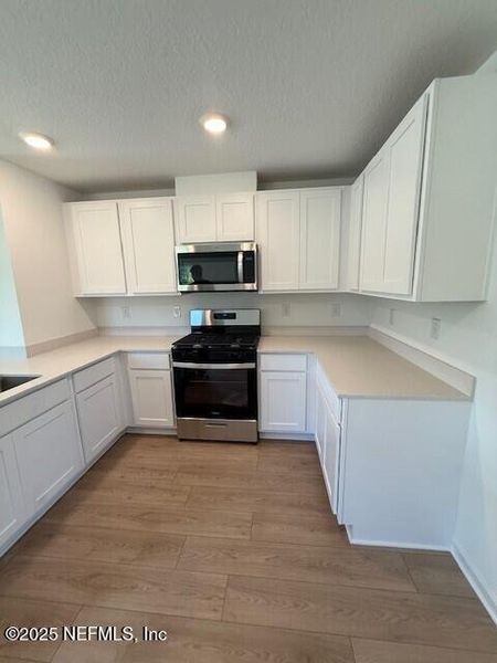 Furnished interior view inside a new home in Grand Reserve, Bunnell (Image 5).