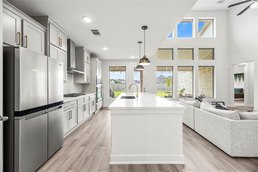 Ditch the takeout and enjoy home cooked meals more often with this help of this chef inspired kitchen.  Ample countertop space makes meal prep and cleanup a breeze, while extensive cabinetry and a walk-in pantry keep every tool and ingredient within reach so you can whip up that favorite family recipe anytime the craving strikes.
