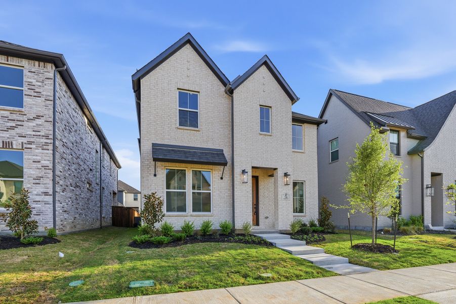 Front exterior of a new home in Light Farms Brenham - 40' Lots, Celina, TX, highlighting curb appeal (Image 23).