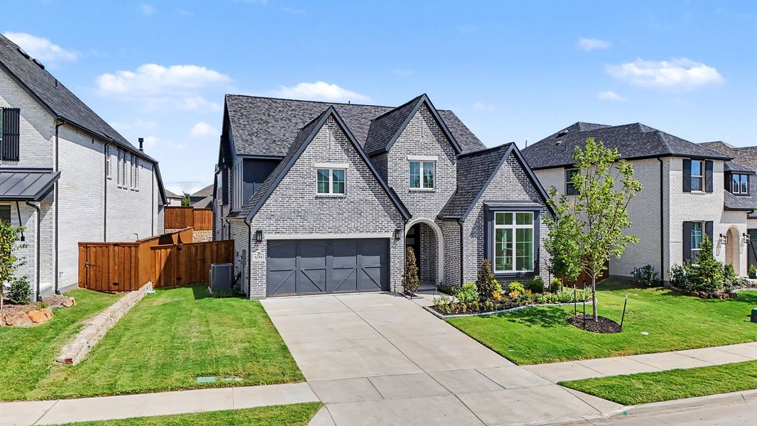 Front exterior of a new home in Aster Park, McKinney, TX, highlighting curb appeal (Image 25).
