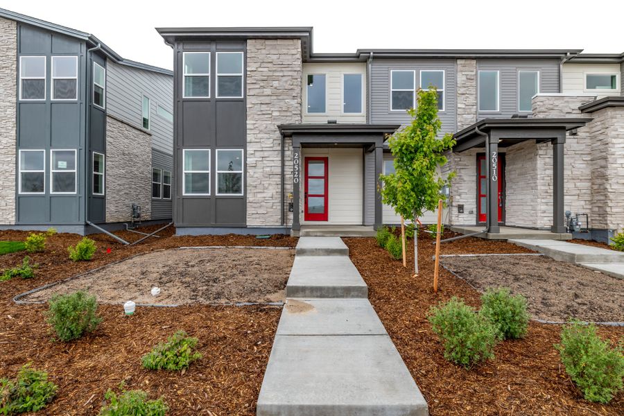 Front exterior of a new home in Painted Prairie, Aurora, CO, highlighting curb appeal (Image 24).