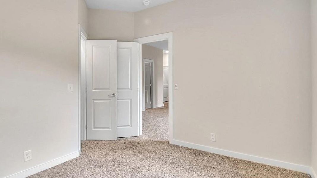 Empty room with light carpet Empty room with light carpet