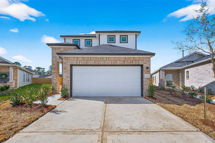 Front exterior of a new home in Woodland Lakes, Houston, TX, highlighting curb appeal (Image 20).