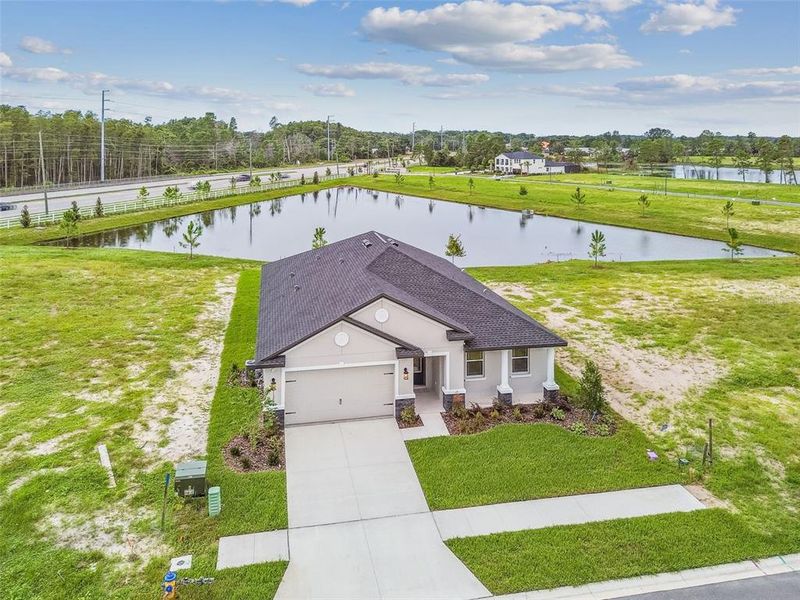 Front exterior of a new home in Hidden Ridge, New Port Richey, FL, highlighting curb appeal (Image 25). Front exterior of a new home in Hidden Ridge, New Port Richey, FL, highlighting curb appeal (Image 25).