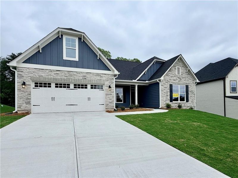Front exterior of a new home in Arbor West, Dawsonville, GA, highlighting curb appeal (Image 2). Front exterior of a new home in Arbor West, Dawsonville, GA, highlighting curb appeal (Image 2).