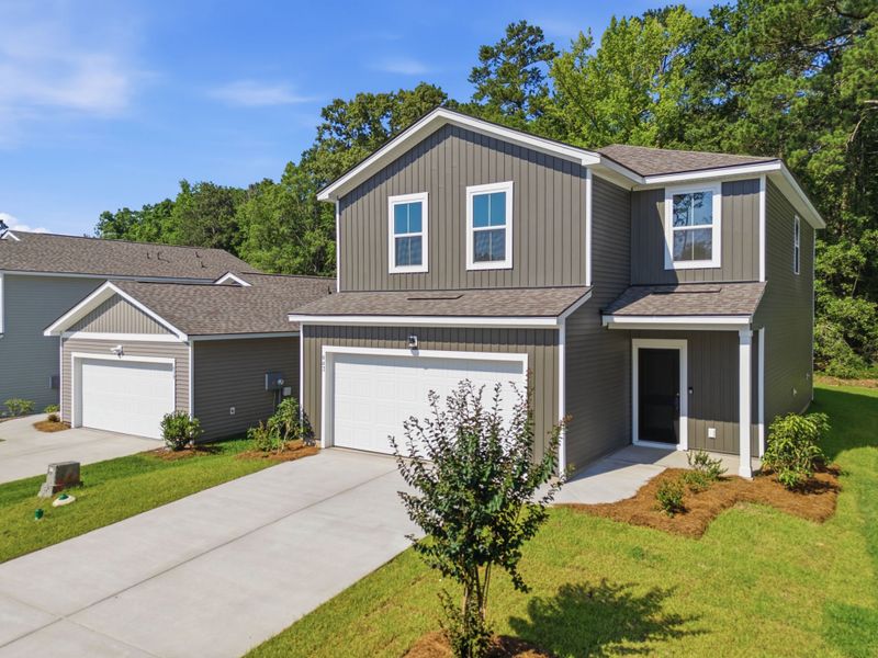 Front exterior of a new home in Grand Arbor, Blythewood, SC, highlighting curb appeal (Image 17). Front exterior of a new home in Grand Arbor, Blythewood, SC, highlighting curb appeal (Image 17).