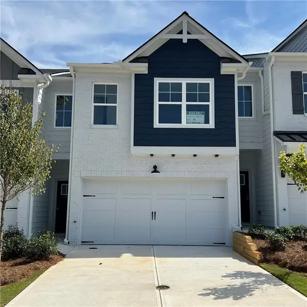 Front exterior of a new home in Old Salem Crossing, Conyers, GA, highlighting curb appeal (Image 1). Front exterior of a new home in Old Salem Crossing, Conyers, GA, highlighting curb appeal (Image 1).