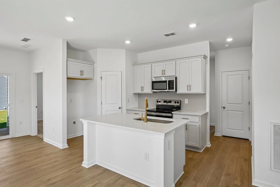 Kitchen featuring the AW Collection® Serene - Clean lines and earthy textures define the space.