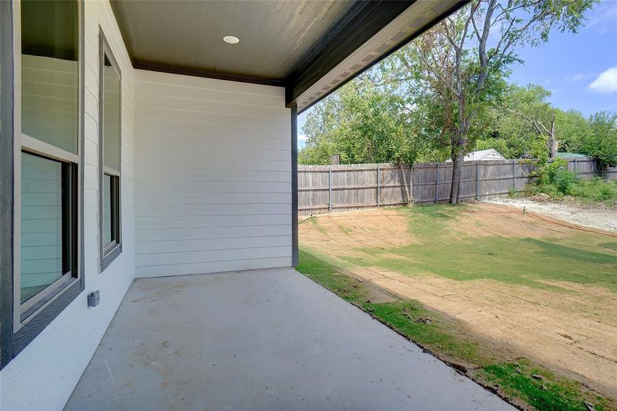 Fenced backyard with a patio Fenced backyard with a patio