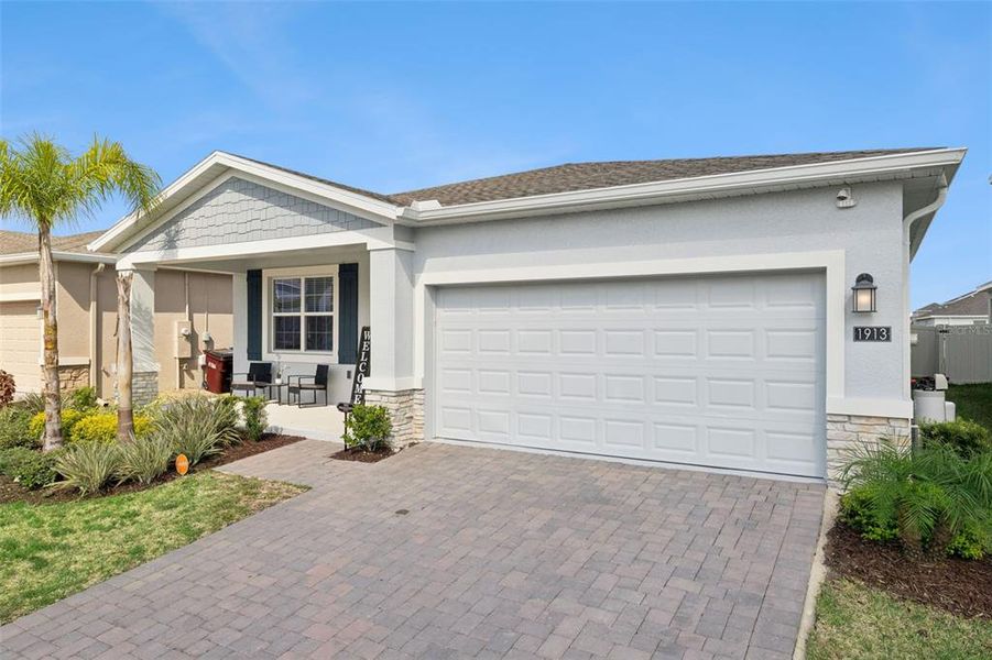 Front exterior of a new home in Tohoqua, Kissimmee, FL, highlighting curb appeal (Image 1). Front exterior of a new home in Tohoqua, Kissimmee, FL, highlighting curb appeal (Image 1).
