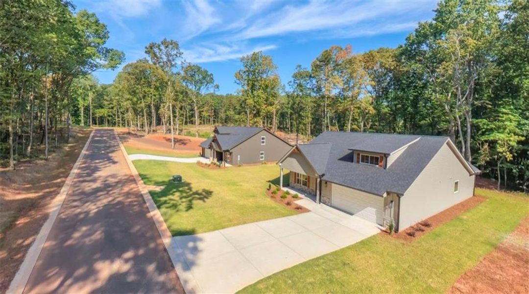 Front exterior of a new home in , Bremen, GA, highlighting curb appeal (Image 27).