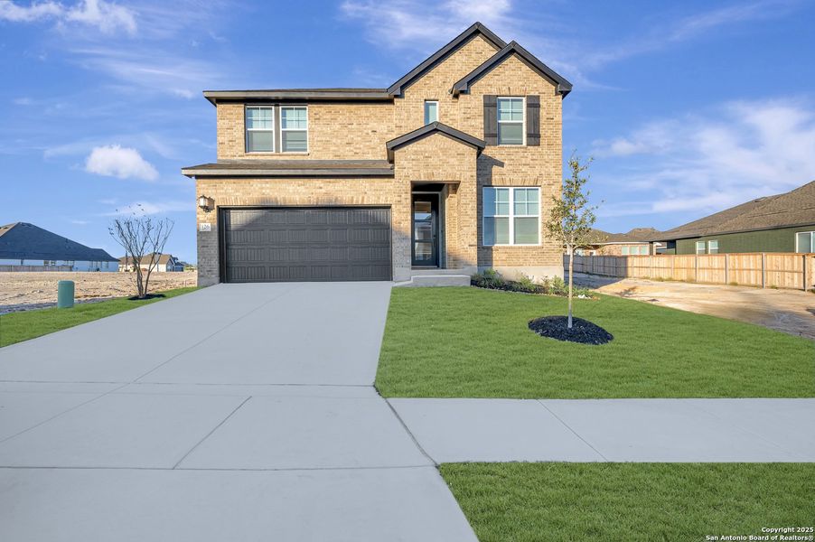 Front exterior of a new home in Mayfair - Select Classic Series, New Braunfels, TX, highlighting curb appeal (Image 1).