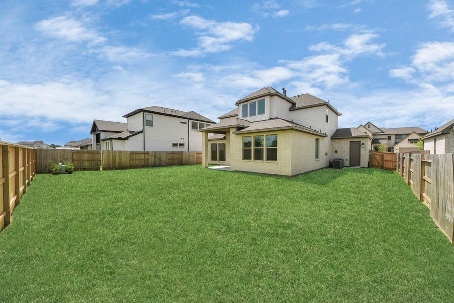 Front exterior of a new home in Marvida, Cypress, TX, highlighting curb appeal (Image 17). Front exterior of a new home in Marvida, Cypress, TX, highlighting curb appeal (Image 17).