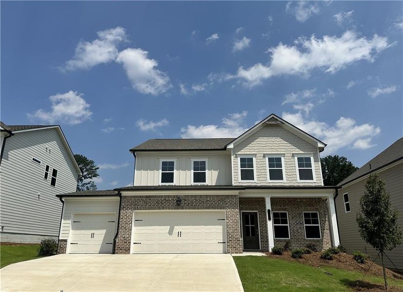 Front exterior of a new home in Summerlin, Winder, GA, highlighting curb appeal (Image 22).