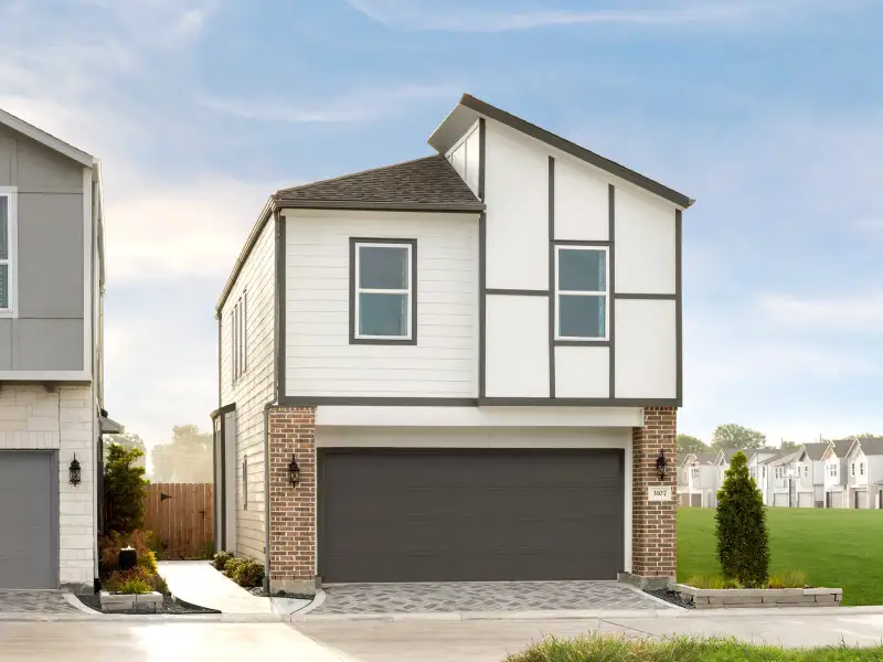 Front exterior of a new home in Katy Grand Village - City Series, Katy, TX, highlighting curb appeal (Image 1). Front exterior of a new home in Katy Grand Village - City Series, Katy, TX, highlighting curb appeal (Image 1).