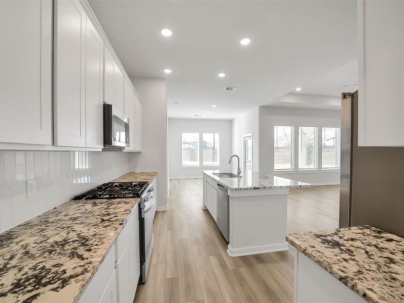 Furnished interior view inside a new home in Sunterra, Katy (Image 13).