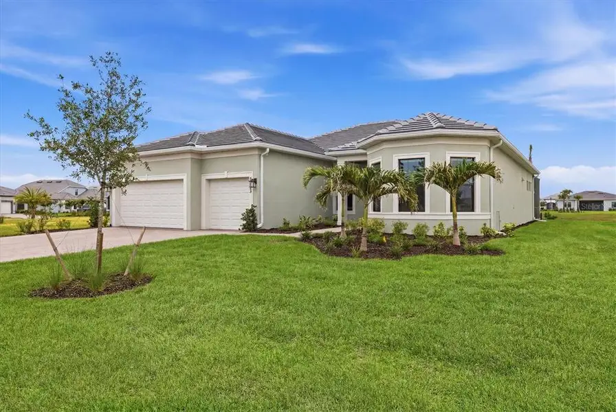 Front exterior of a new home in Del Webb Catalina, Lakewood Ranch, FL, highlighting curb appeal (Image 20).