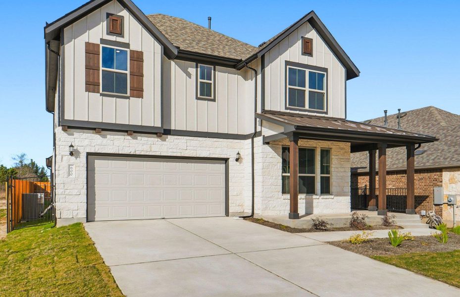 Front exterior of a new home in Saddleback at Santa Rita Ranch, Liberty Hill, TX, highlighting curb appeal (Image 2). Front exterior of a new home in Saddleback at Santa Rita Ranch, Liberty Hill, TX, highlighting curb appeal (Image 2).