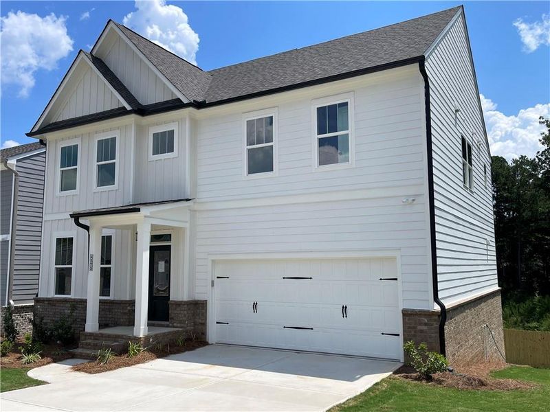 Front exterior of a new home in Edenglen, Buford, GA, highlighting curb appeal (Image 16).