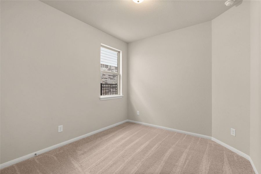 Your secondary bedroom features plush carpet, fresh paint, closet, and a large window that lets in plenty of natural lighting. 2