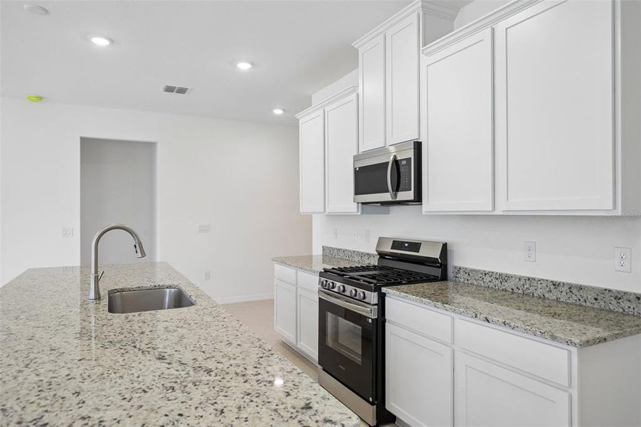 Furnished interior view inside a new home in Heritage Station, Punta Gorda (Image 28). Furnished interior view inside a new home in Heritage Station, Punta Gorda (Image 28).