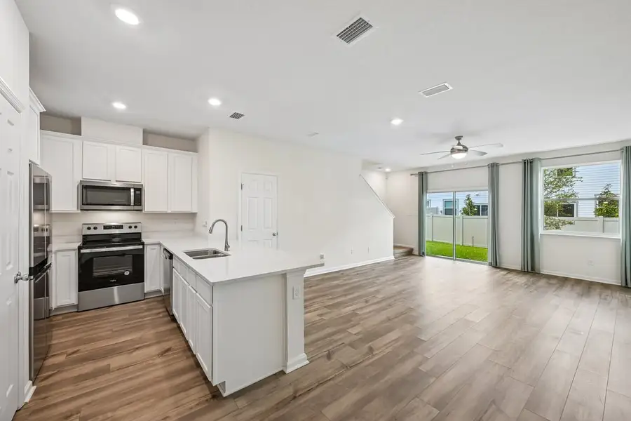 Furnished interior view inside a new home in Orchard Park Townhomes, St. Augustine (Image 9).