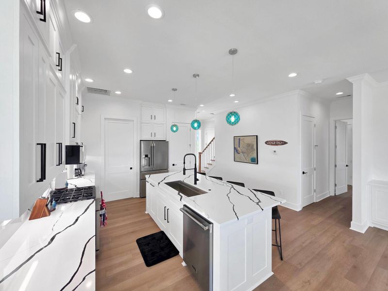 Exceptional Kitchen with plenty of counter space and a Wolfe gas range and Frigidaire stainless refrigerator, dishwasher and microwave