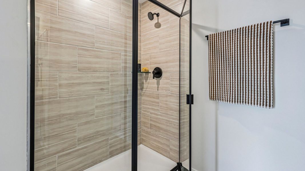 Primary bathroom with glass-enclosed shower