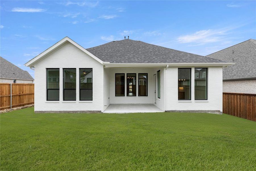 Front exterior of a new home in Hillstead, Lavon, TX, highlighting curb appeal (Image 24). Front exterior of a new home in Hillstead, Lavon, TX, highlighting curb appeal (Image 24).